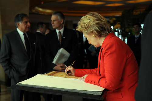 Secretary Clinton signs Remembrance Book [State Dept. Photo]