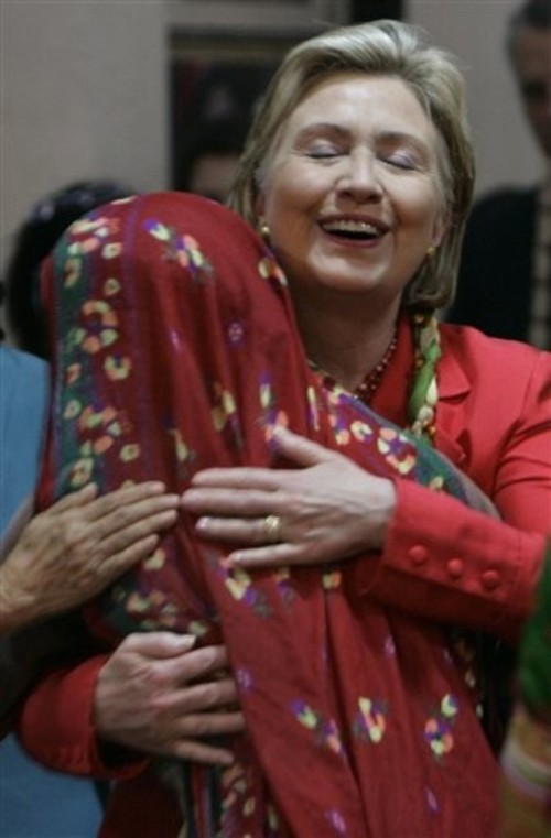 SOS Hillary Clinton w/member of the Self Employed Women's Association, July 18th, 2009(AP Photo/Rajanish Kakade)